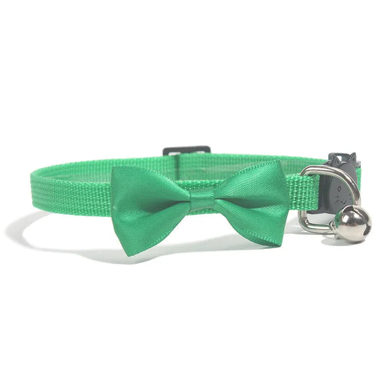 Adjustable striped nylon cat collar with a bell shown in multiple colours including red, blue, green, and pink.