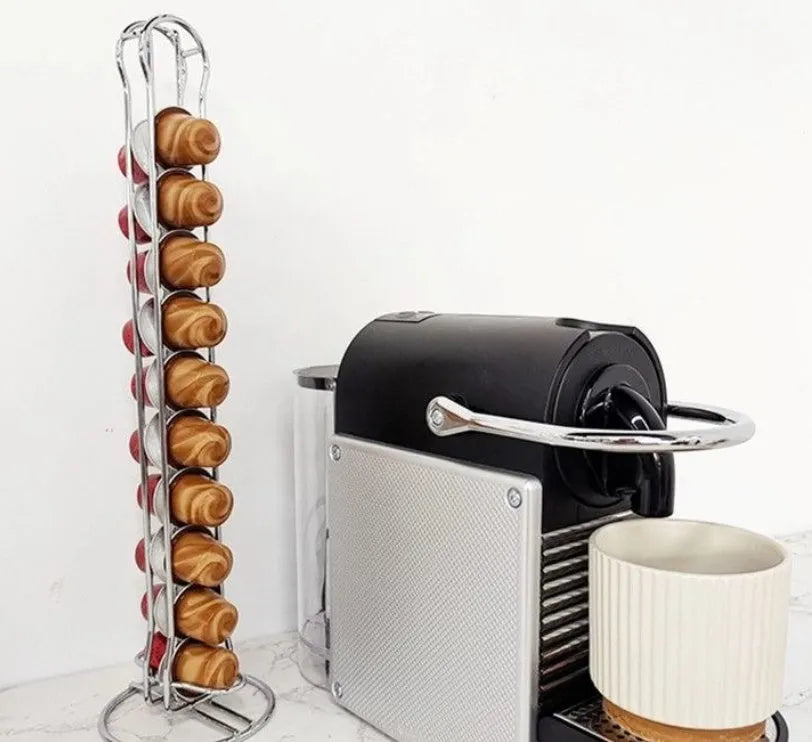 Black wrought iron coffee capsule rack holding 20 pods on display shelves.