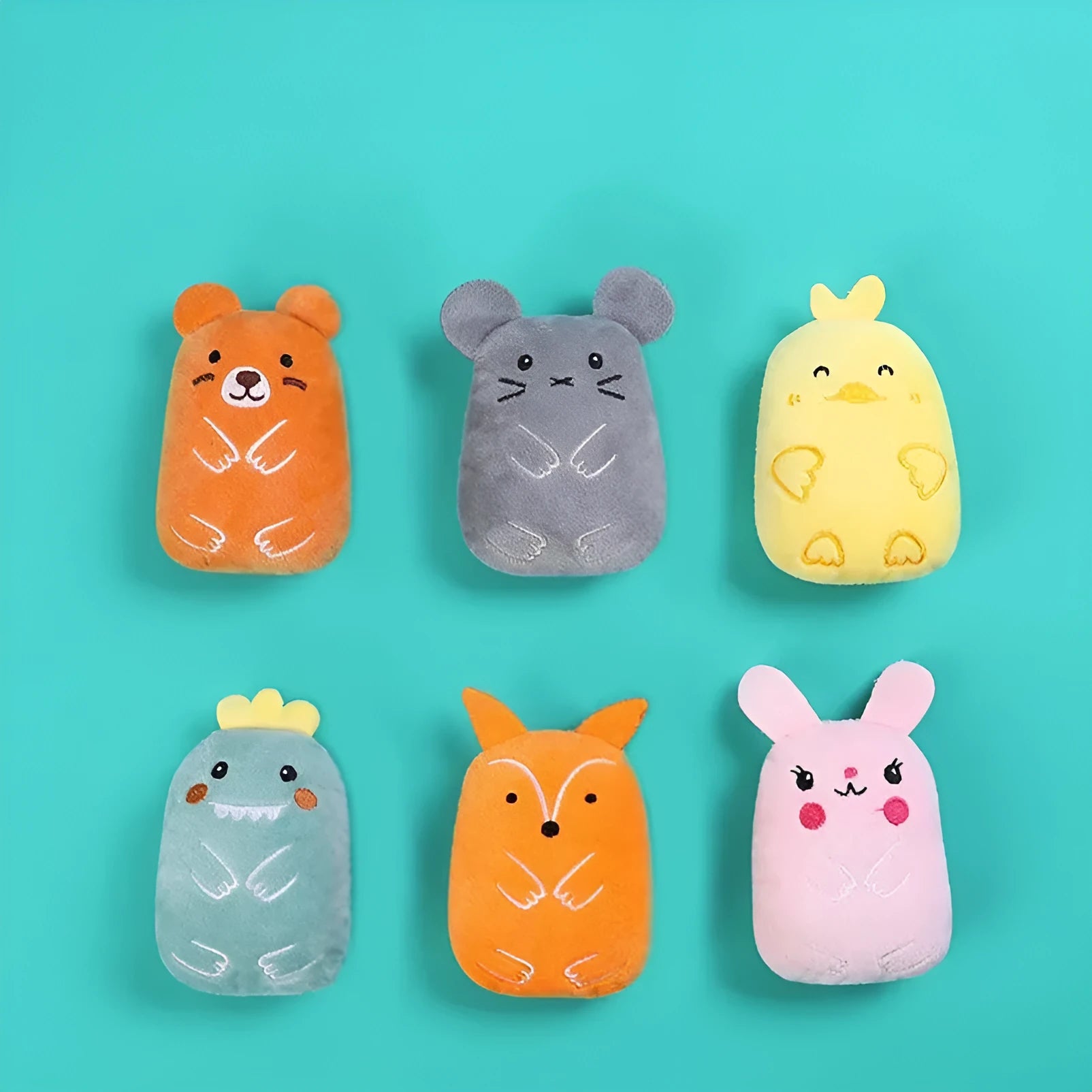 Small plush catnip toy with vocal feature for feline teeth grinding and claw play