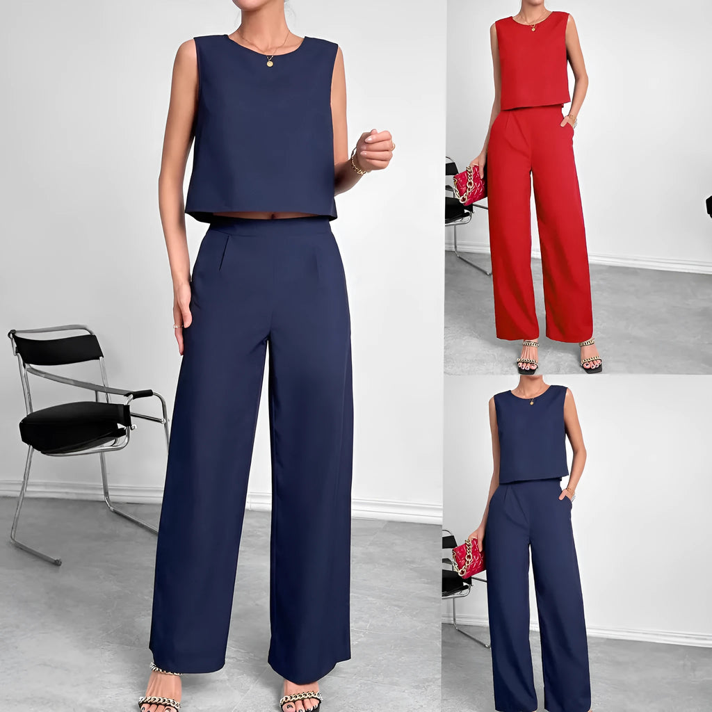 Women's red polyester two-piece set with sleeveless top and wide leg trousers on mannequin