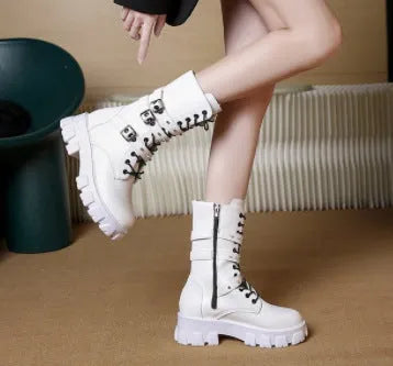Women's black mid-calf knight boots with a metal buckle strap and side zipper.