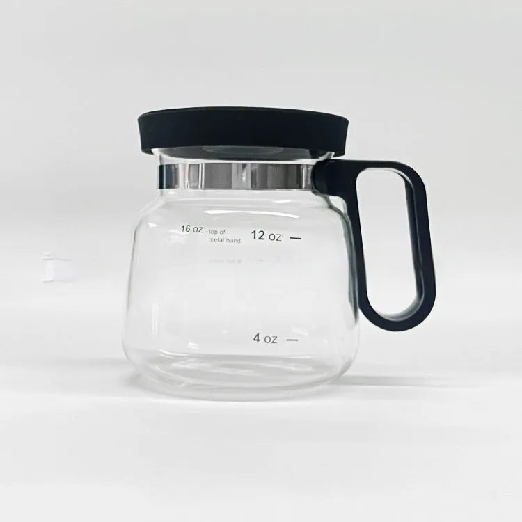 Transparent borosilicate glass coffee maker with black silicone cover on a kitchen counter