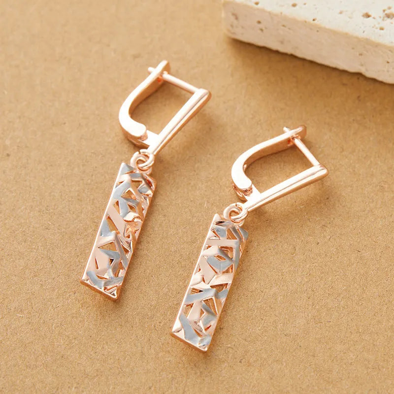 Two-tone rectangular hollow stud earrings for women, made from alloy with an electroplated finish.
