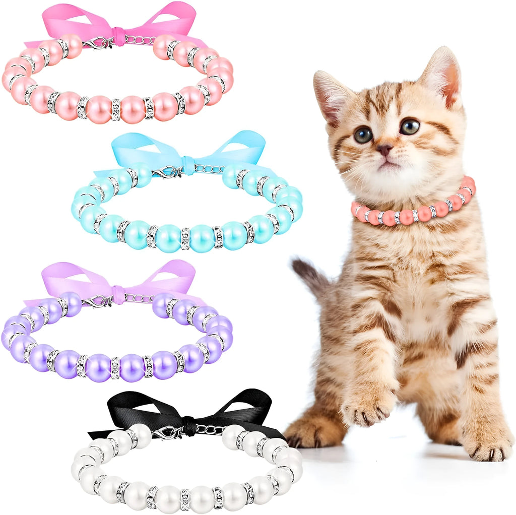 Small dog wearing blue pearl and rhinestone necklace with ribbon bow
