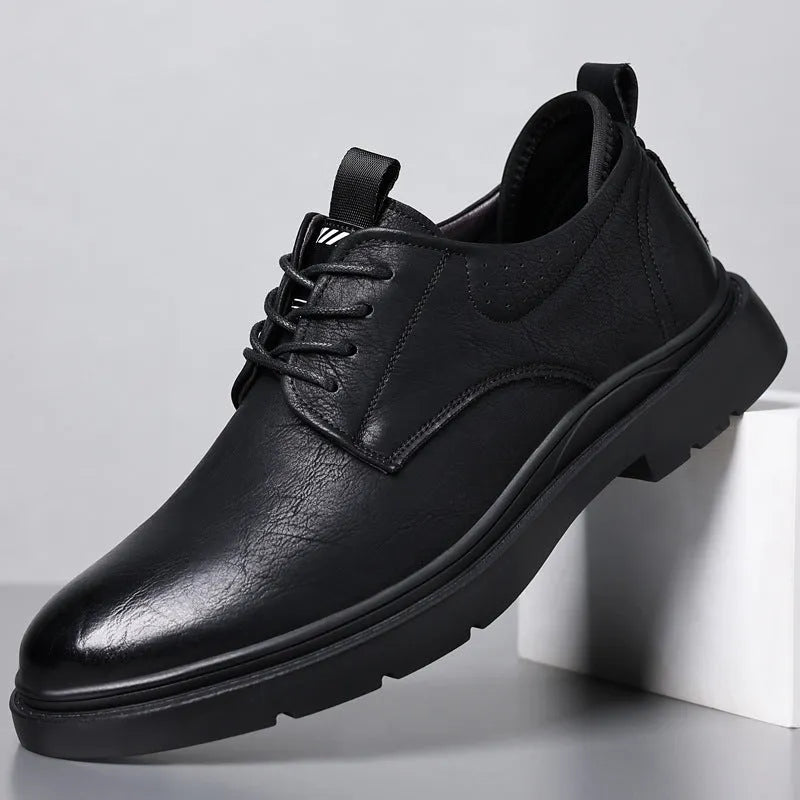 Men's black leather shoes with sewing line details and rubber sole