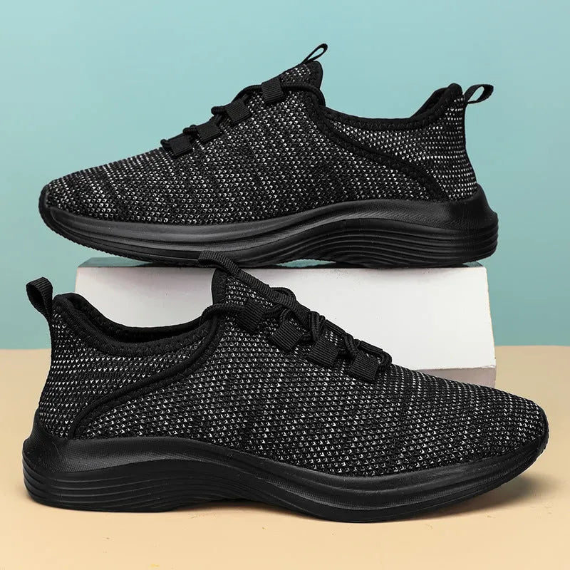 Women's low-top casual sneakers in black, grey, or pink with breathable mesh upper and lightweight EVA sole.