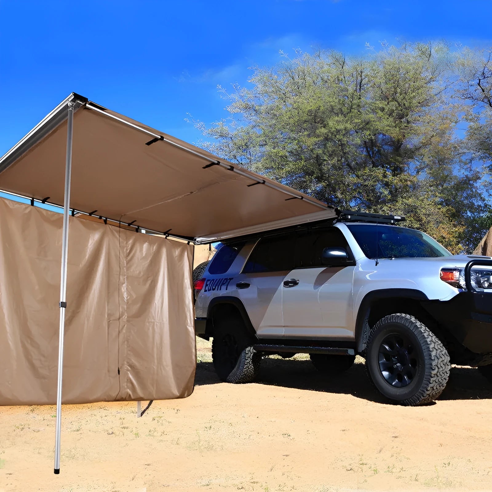 Camouflage car sunshade tent with aluminium poles set up outdoors, showing two-room interior.