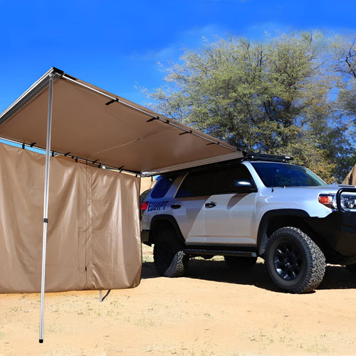 Camouflage car sunshade tent with aluminium poles set up outdoors, showing two-room interior.