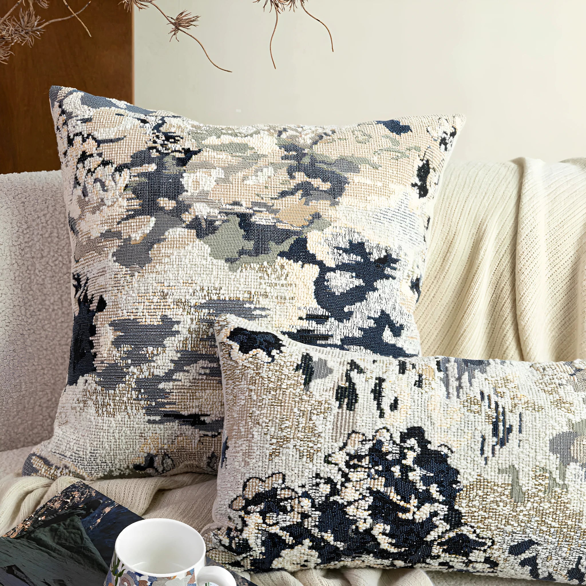 Antique blue abstract floral decorative cushion on wool blend fabric in square and waist sizes.