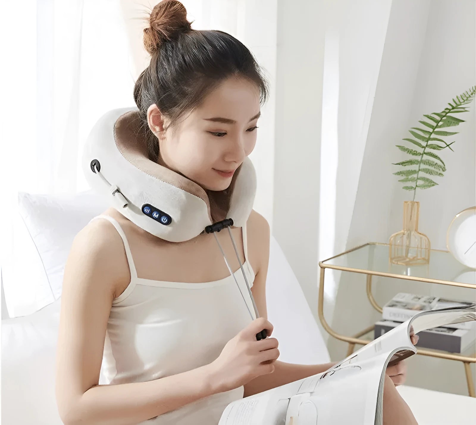 Brown U shaped electric neck massage pillow with heating function on wooden table