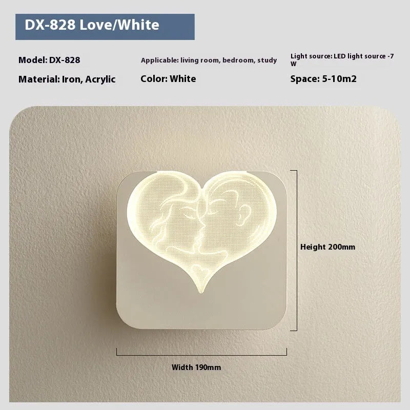 Modern bedside lamp with an acrylic shade showing a love heart motif and three-colour LED light.