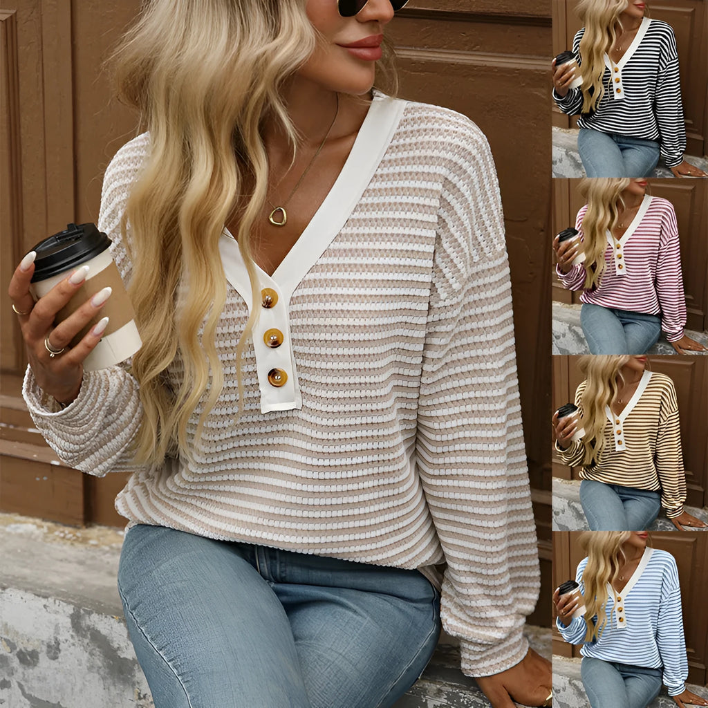 Women's loose fit patchwork V-neck pullover top with long sleeves and button fastenings.
