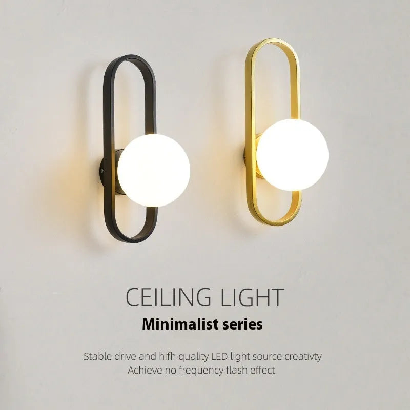 Minimalist wall-mounted lamp with glass shade and iron body in black finish