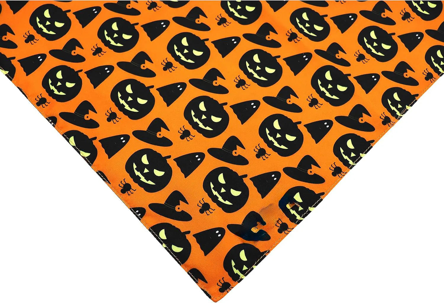Reversible Halloween dog bandana showing pumpkin pattern on orange side and spider web design on black side