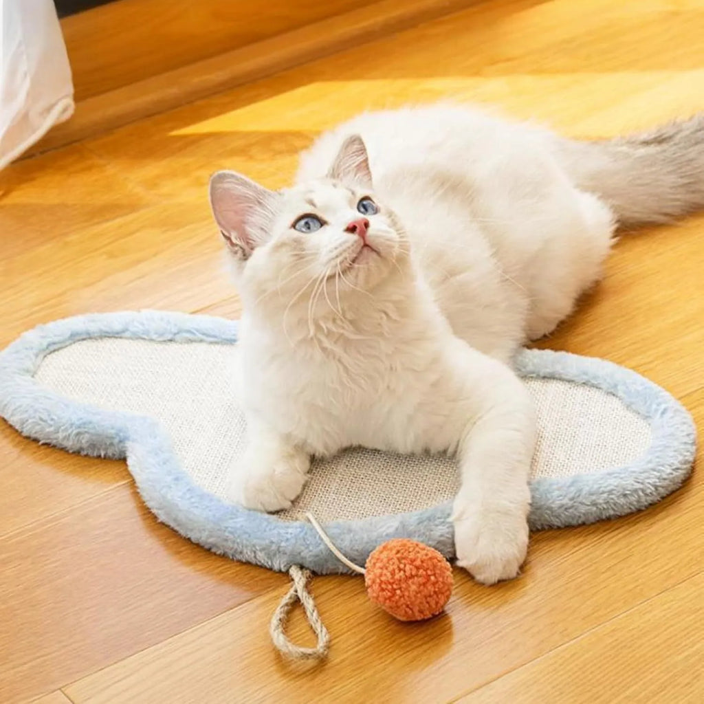 White wall-mounted cat scratching mat with sleeping cat cartoon design on natural sisal surface