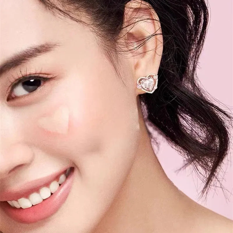 White heart-shaped stud earrings for women with copper construction and electroplated finish