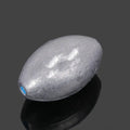 Tongxin olive-shaped rugby lead sinker for sea fishing with scale texture, showing plastic core construction.