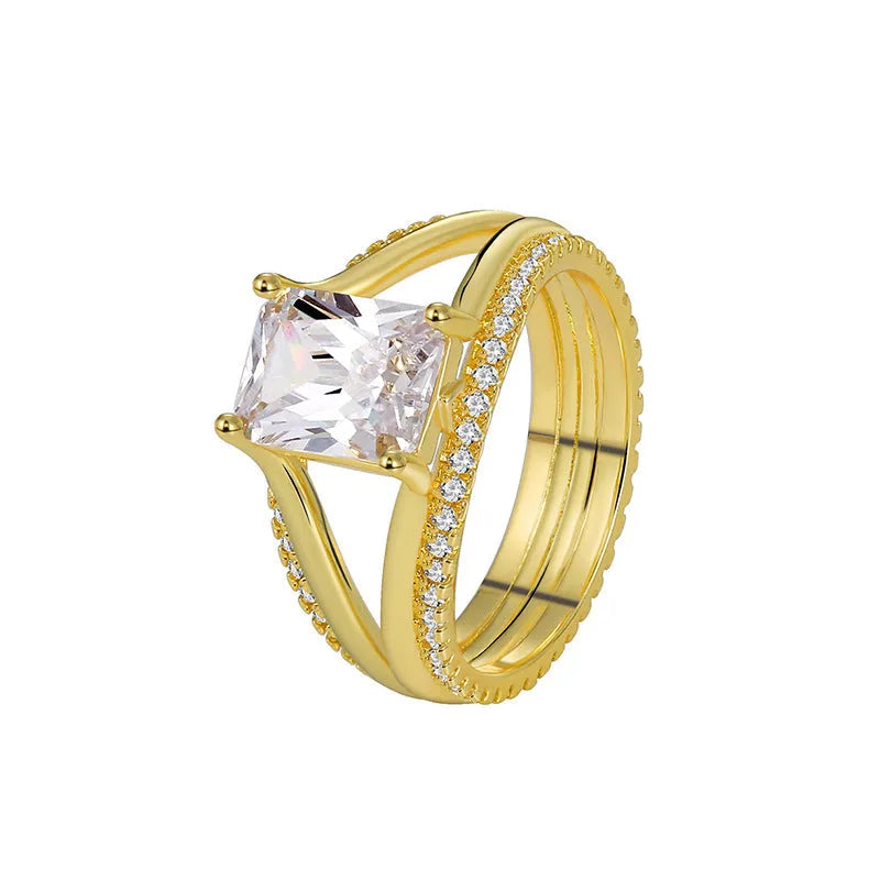 Gold colour geometric women's ring with a square zircon stone on a copper band.