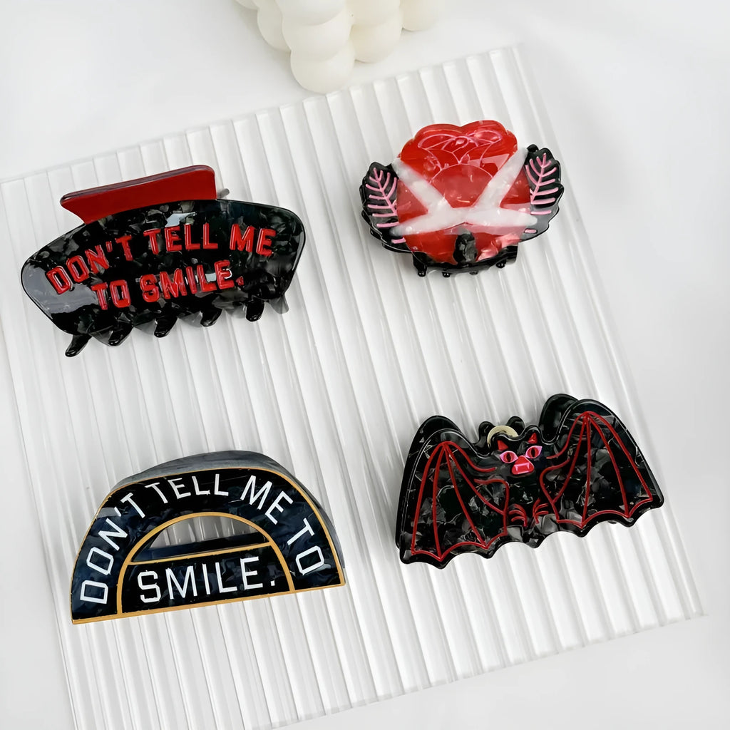 Halloween hair clip with shark and vinegar bat design in four style options