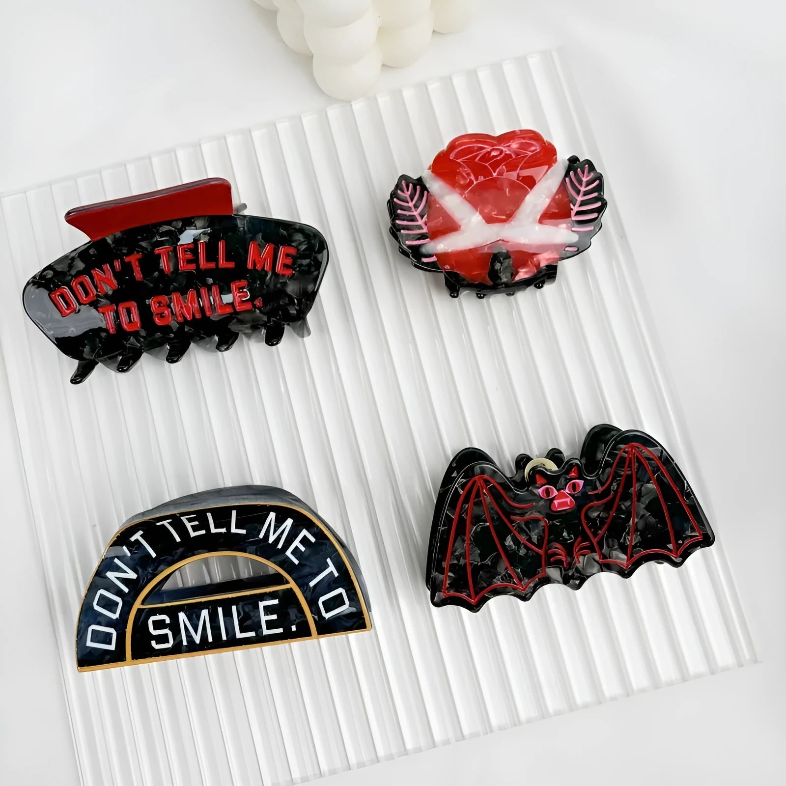 Halloween hair clip with shark and vinegar bat design in four style options
