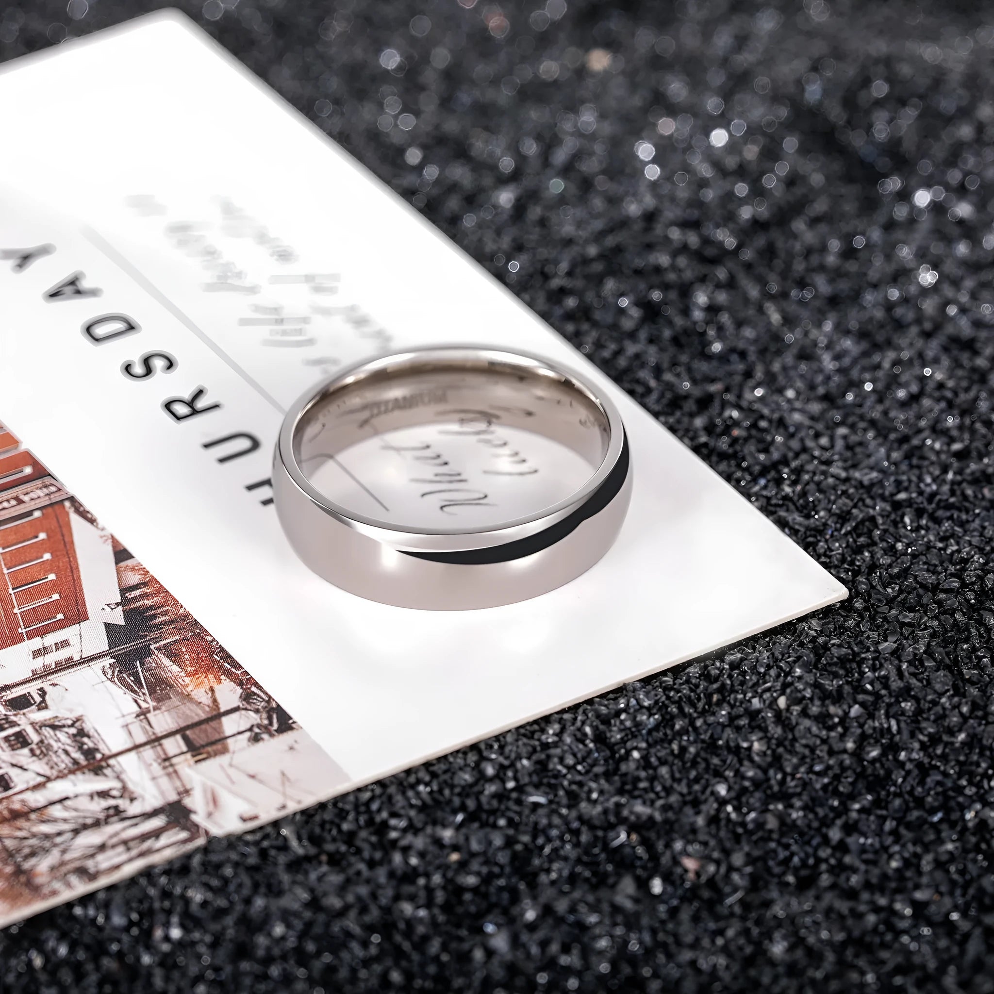Silver titanium steel ring showing different width options on a hand