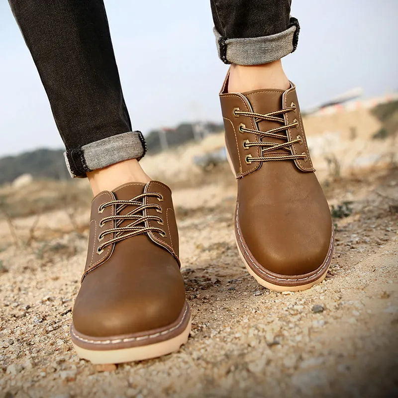 Men's black mid-top British leather style boots with waterproof uppers and rubber soles