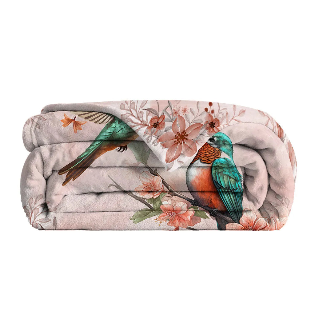 Pink hummingbird floral flannel velvet fleece throw blanket on sofa