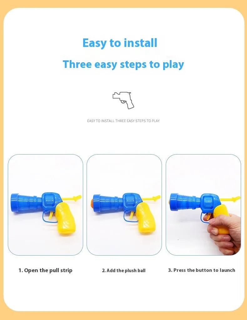 Plush cat toy launch gun with soft yarn balls for interactive indoor pet play.