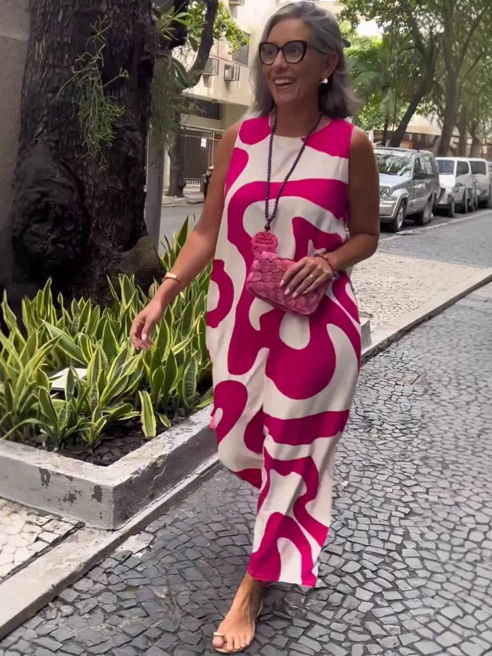 V-neck printed sleeveless dress in Rose Red with abstract pattern and A-line skirt for commuting style