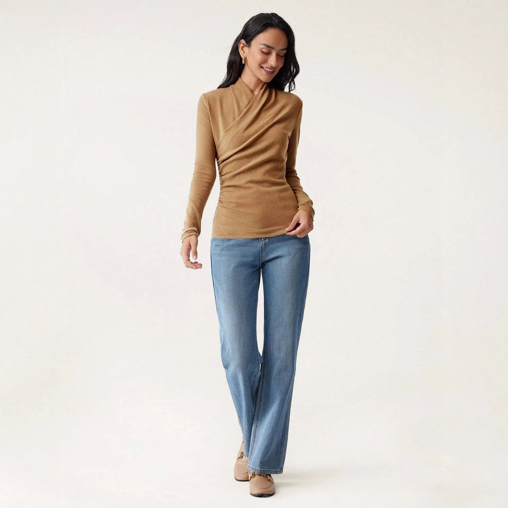 Camel coloured women's slim fit long sleeve pullover sweater on a hanger.
