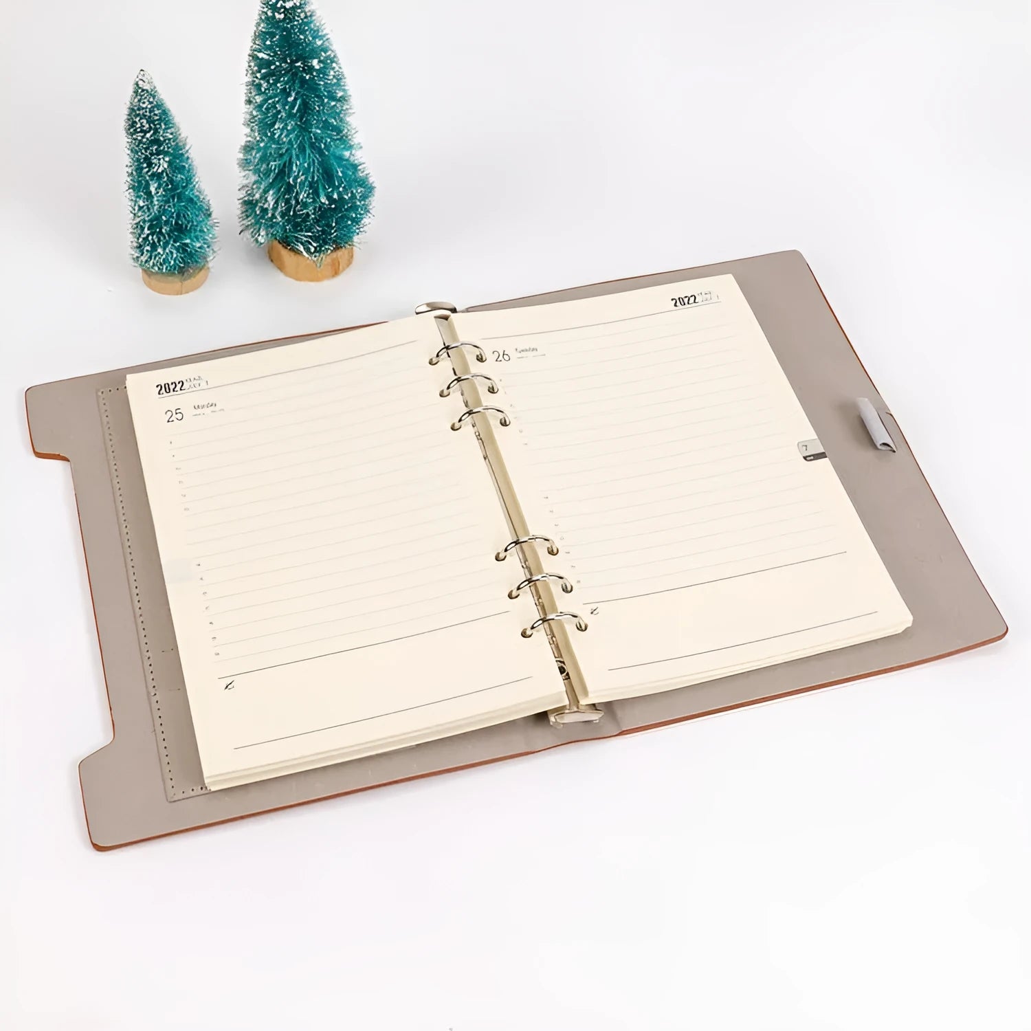 White A5 loose-leaf notebook inner pages with monthly plan layout on a plain background