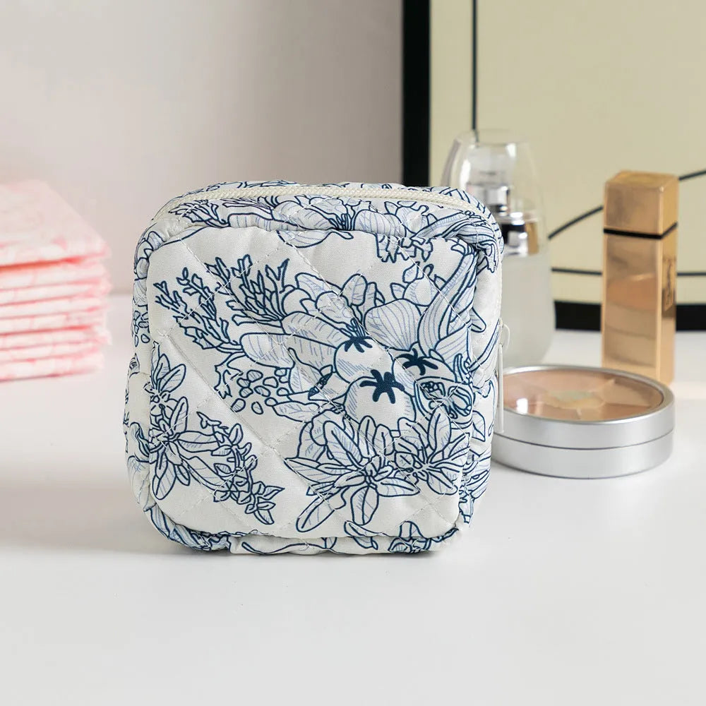 Women's floral patterned polyester key storage bag with sewing thread detail.