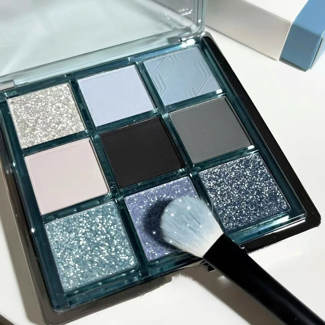 MUGELEEN nine-colour eye shadow palette 08 showing matte and shimmer blue smoked shades