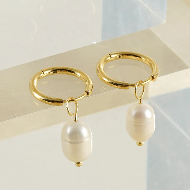 Gold coloured stainless steel geometry earrings with pearl decorative elements for women