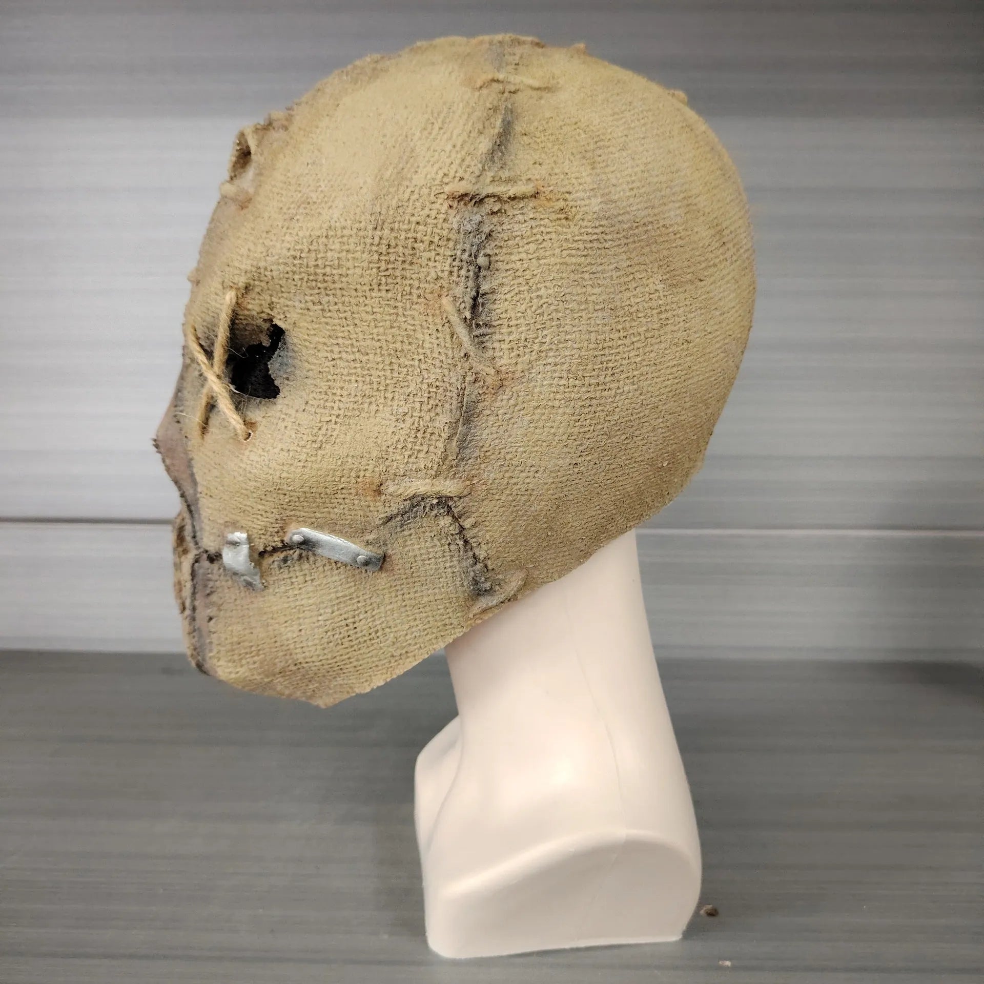 Scarred skull latex mask for adult Halloween costumes showing detailed scar texture
