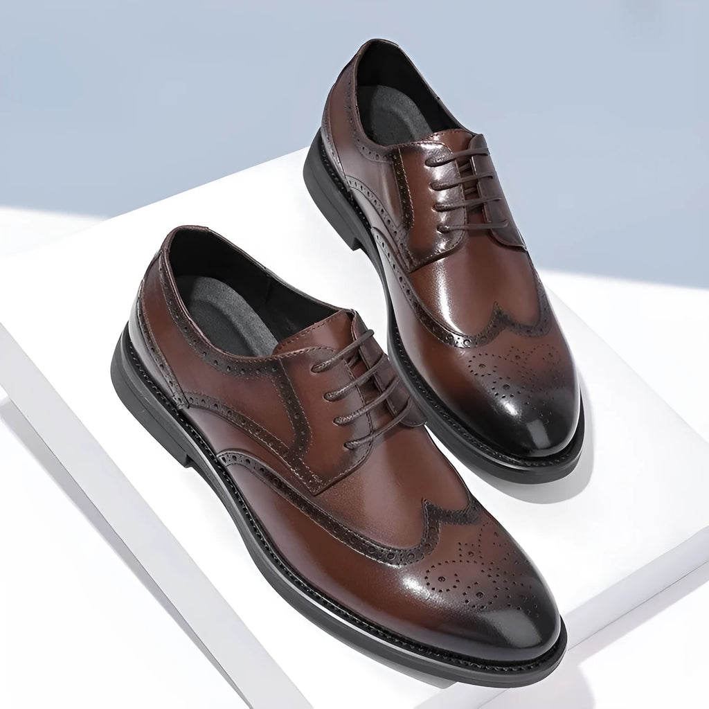 Men's black brogue leather shoes with traditional perforations and Oxford-style construction