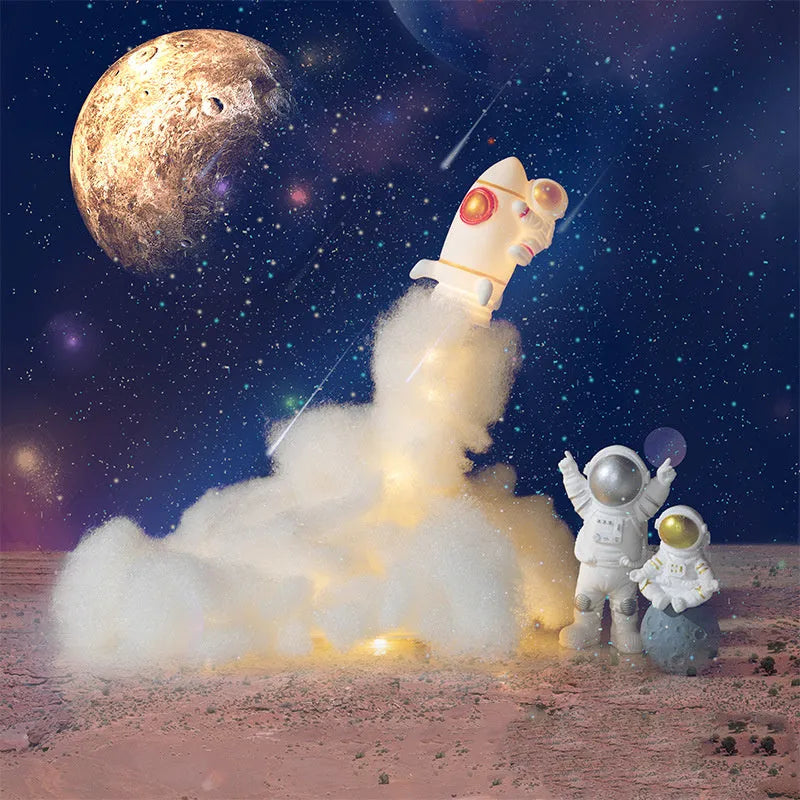 DIY astronaut rocket night light kit with LED string lights and build materials on a desktop