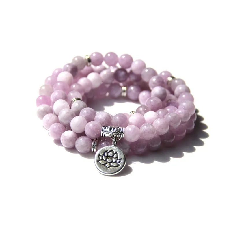 Vintage natural stone bracelet for women with a geometric lotus pendant on a model's wrist.