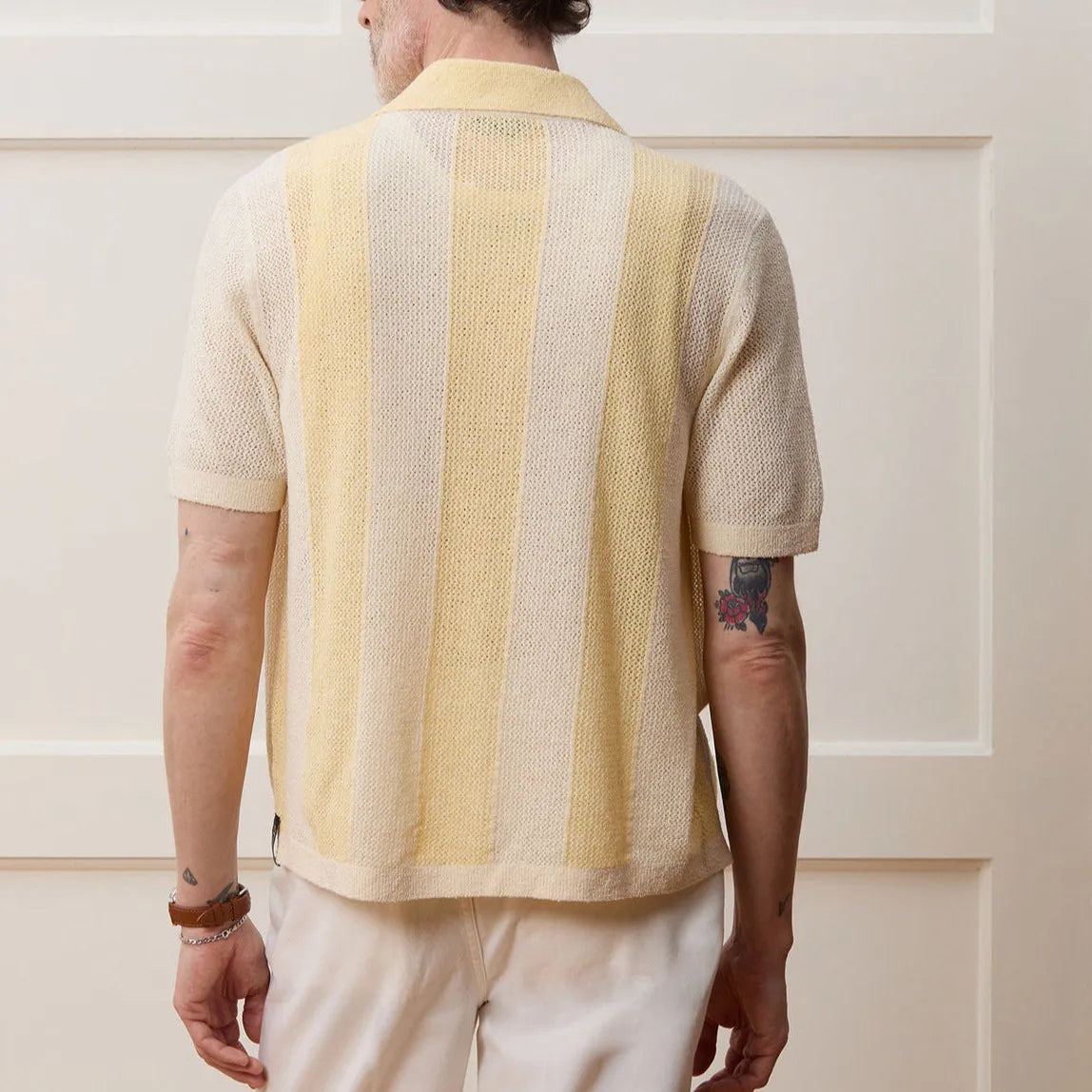 Yellow casual polo shirt with hollow-out pattern and asymmetric design, short sleeves