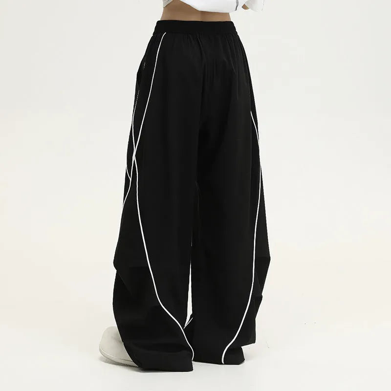 Black pleated wide-leg hip hop trousers with striped pattern and mid-waist design
