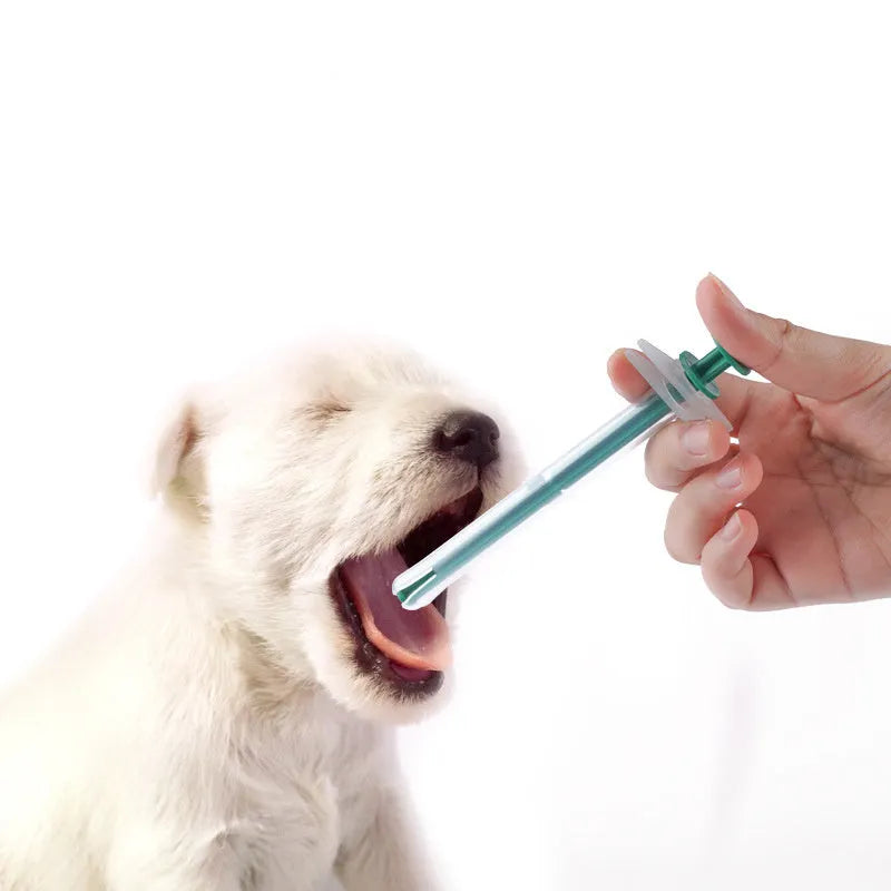 Two pet pill shooters with soft silicone tips for administering tablets to cats and dogs.