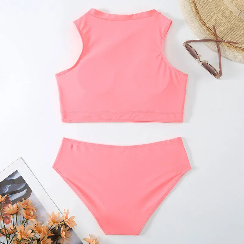 Pink high-waist bikini set with matching bra and shorts on neutral background