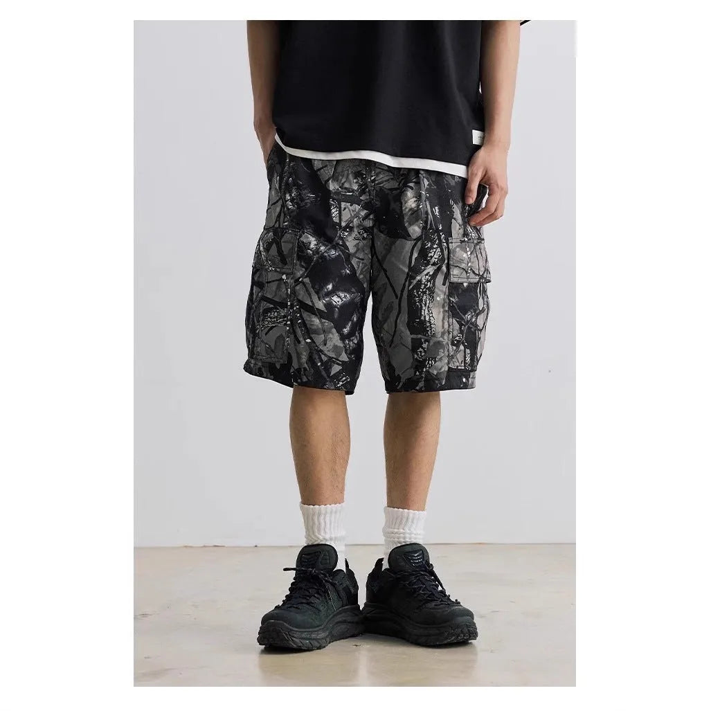 Loose straight-leg denim shorts in army green with a zip fly and elasticated mid-waist.