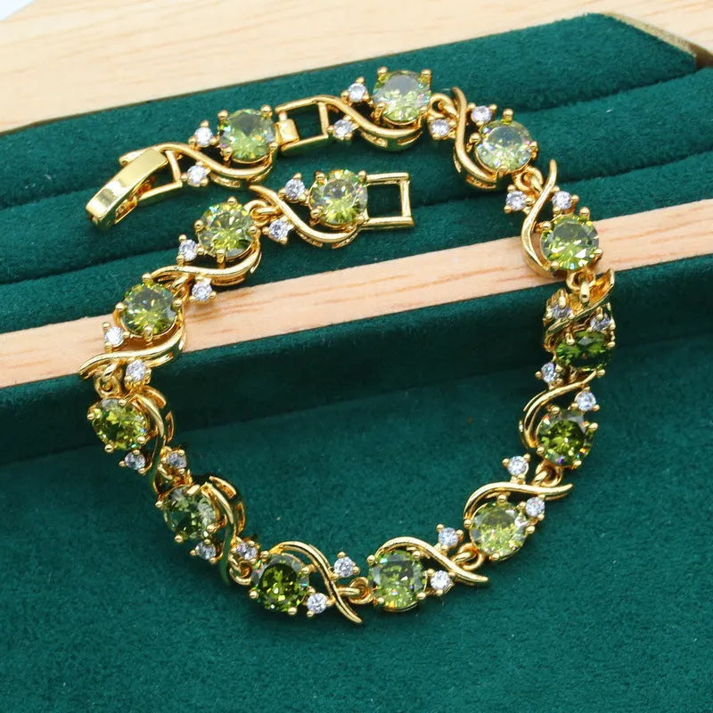 Full rhinestone zircon women's jewellery set showing necklace with snake bones chain, earrings, and ring in olive green or red.
