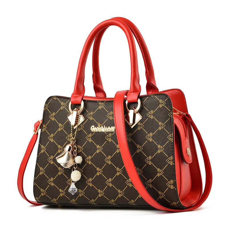 Women's geometric print messenger bag in PU material with internal organisation pockets and zipper closure