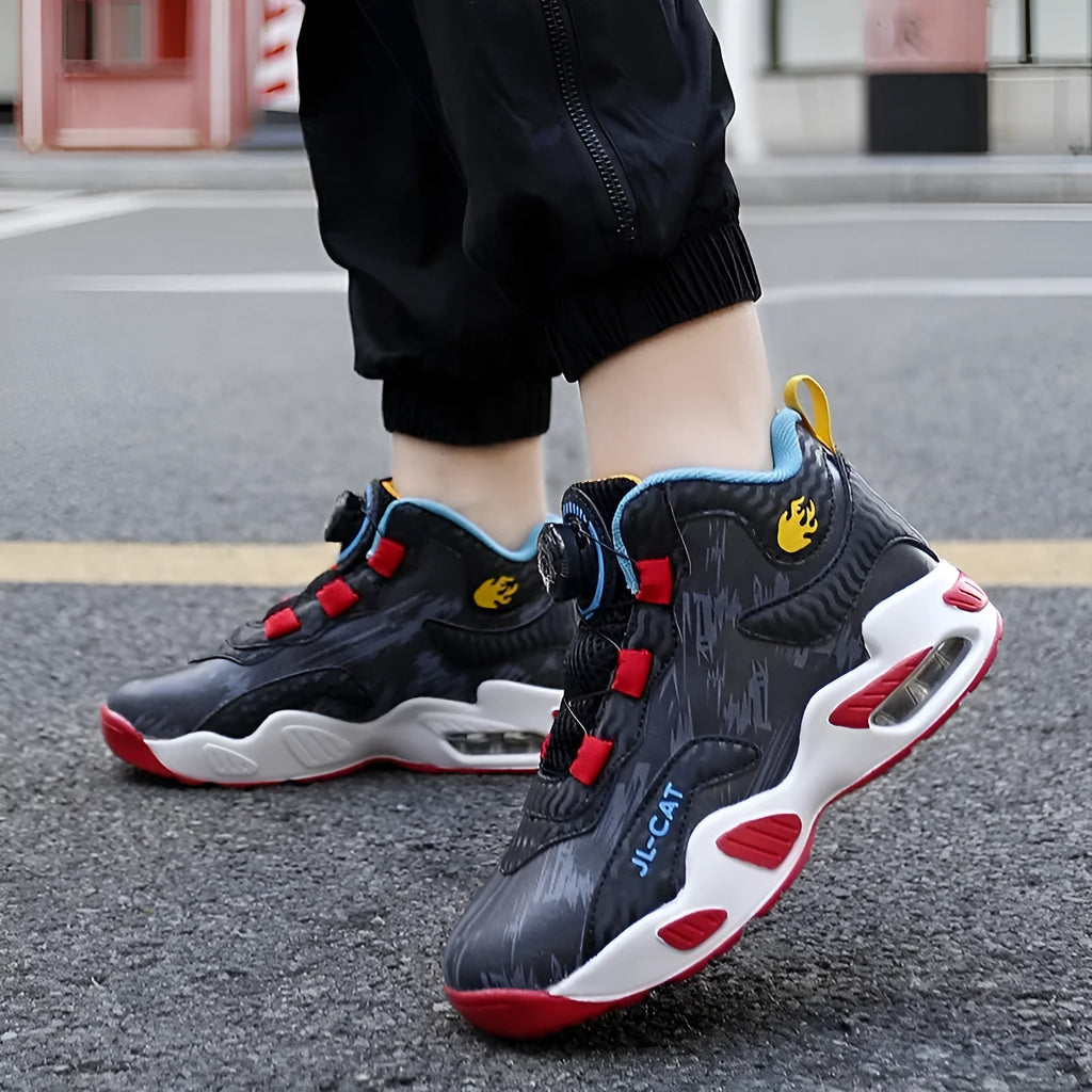 Children's black and colour basketball shoes with a rotating button fastening on the side.