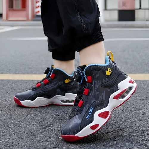 Children's black and colour basketball shoes with a rotating button fastening on the side.