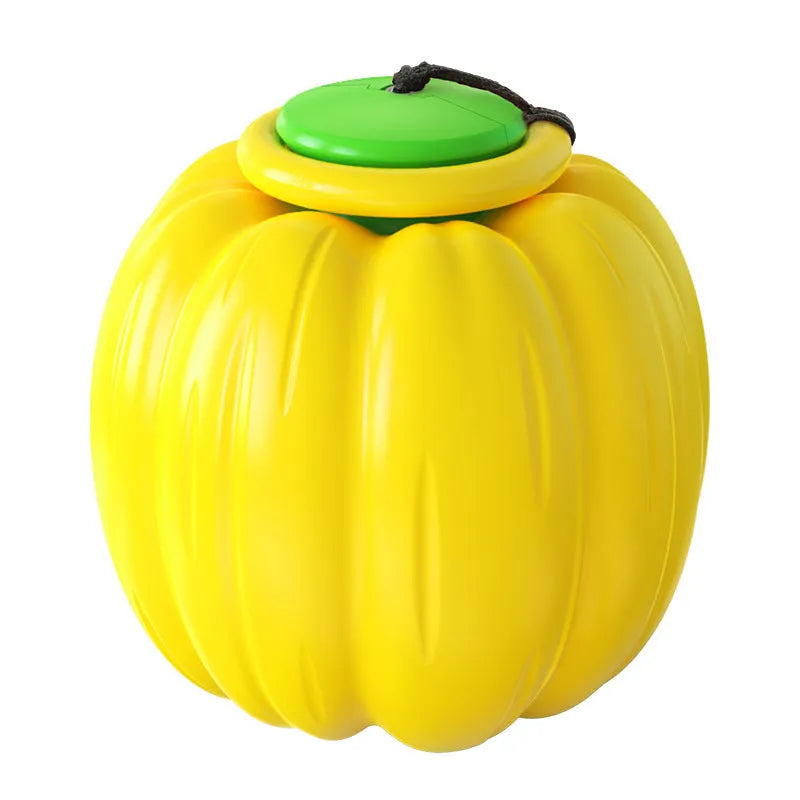 Green, orange, and yellow pumpkin-shaped squeaker dog ball toy for small dogs, shown with size scale.