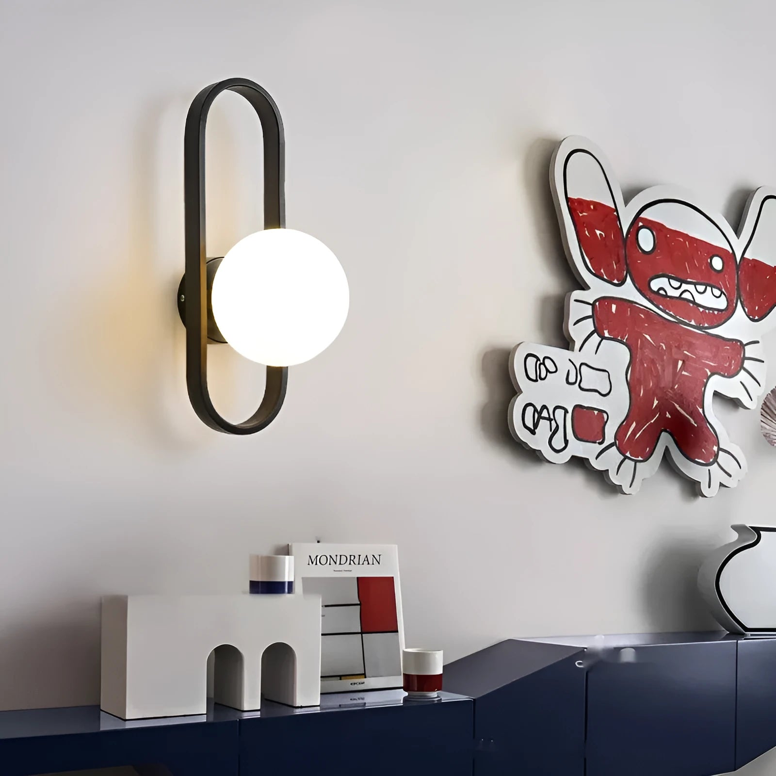 Minimalist wall-mounted lamp with glass shade and iron body in black finish
