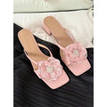 Korean-style women's sandals with chunky heel, square toe, satin upper with floral details in cream-white colour